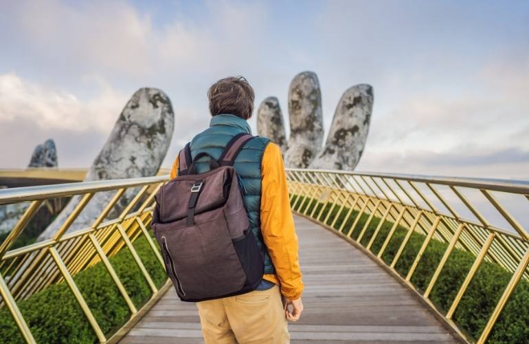 tourist on golden bridge on bana hills