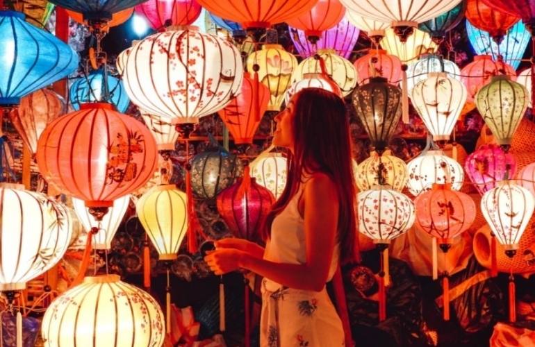 tourist immersing in the world of lanterns in Hoian