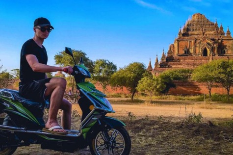 Tourists enjoy visiting Bagan by electric bike.