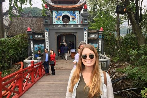 Tourists on The Huc Bridge on Hoan Kiem Lake