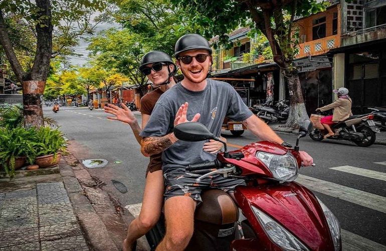 Riding a motorbike on the street of Hoian